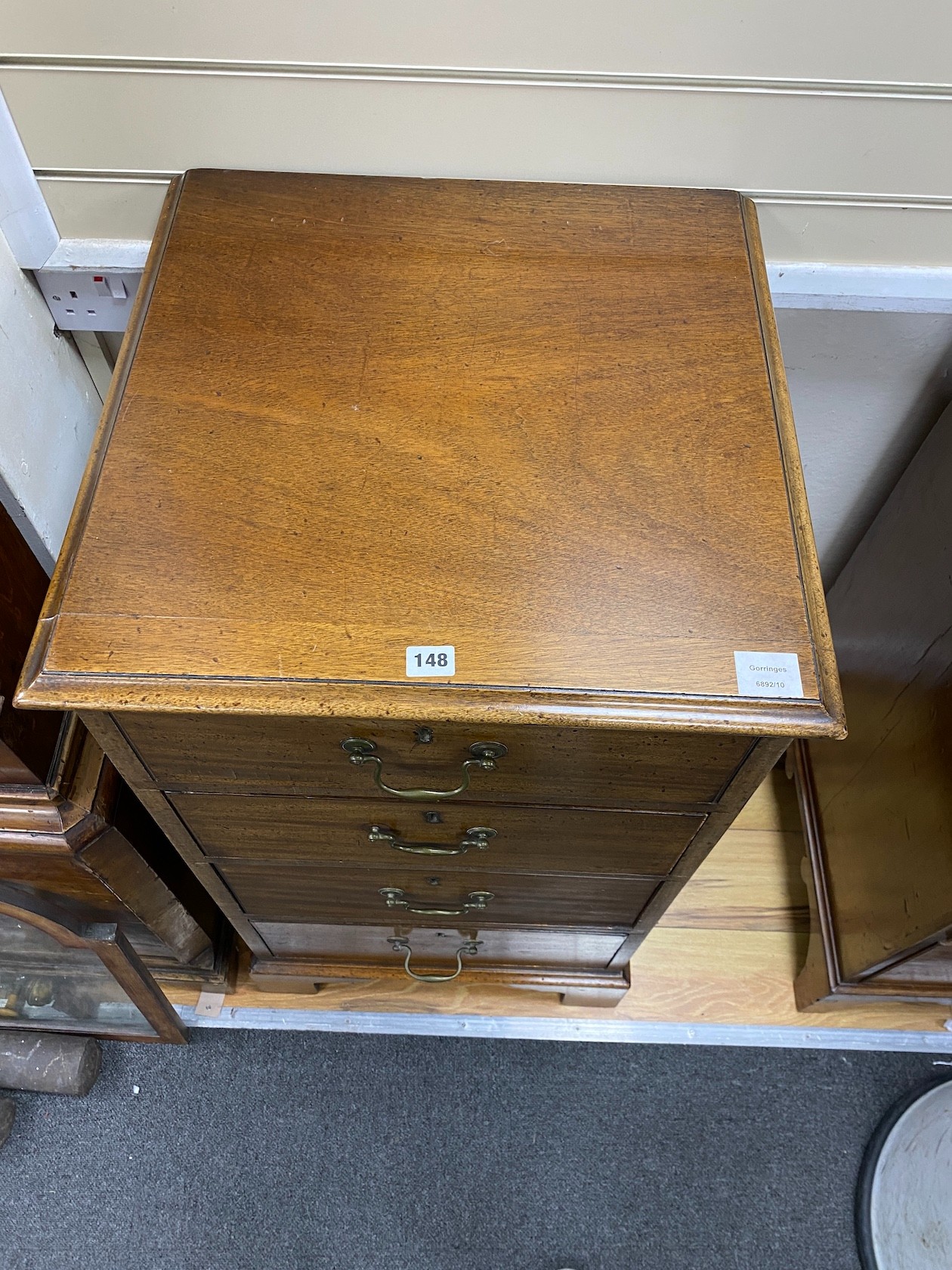 A mahogany chest of four short drawers, width 53cm, depth 53cm, height 96cm